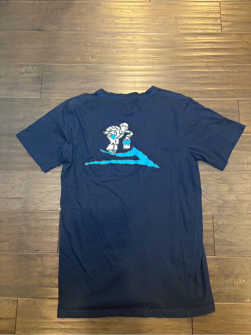 Lokai Navy Graphic Tee with Blue Surf Logo. Size Large.